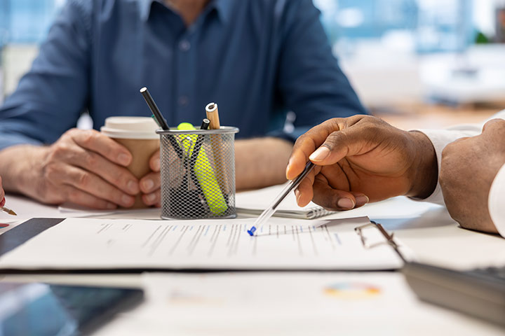 senior-people-reading-retirement-plan-contract-terms-with-broker